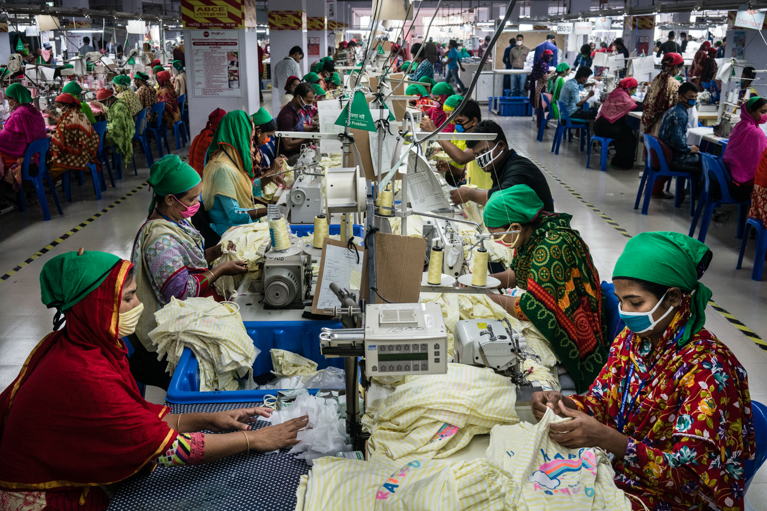 Factory hall garments factory, women sowing